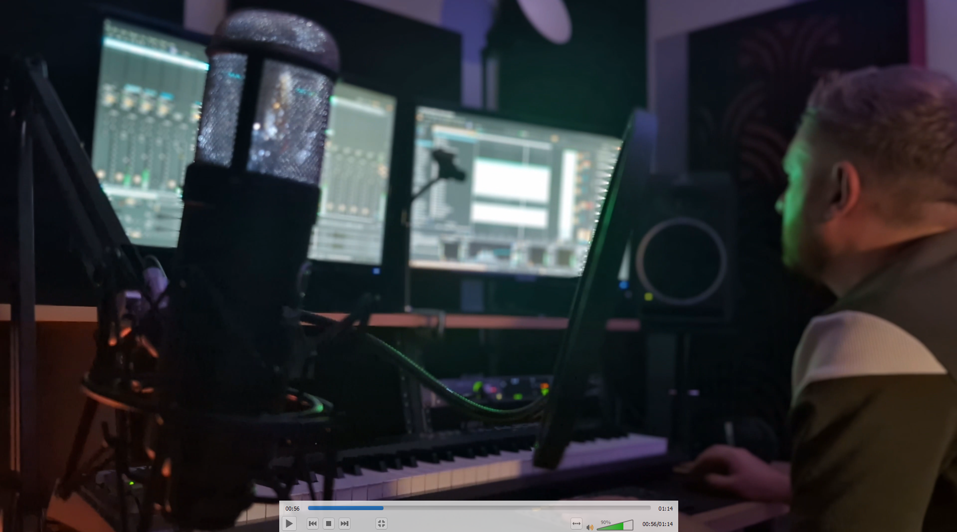 Ben Botfield working beside a vocal microphone in his recording studio