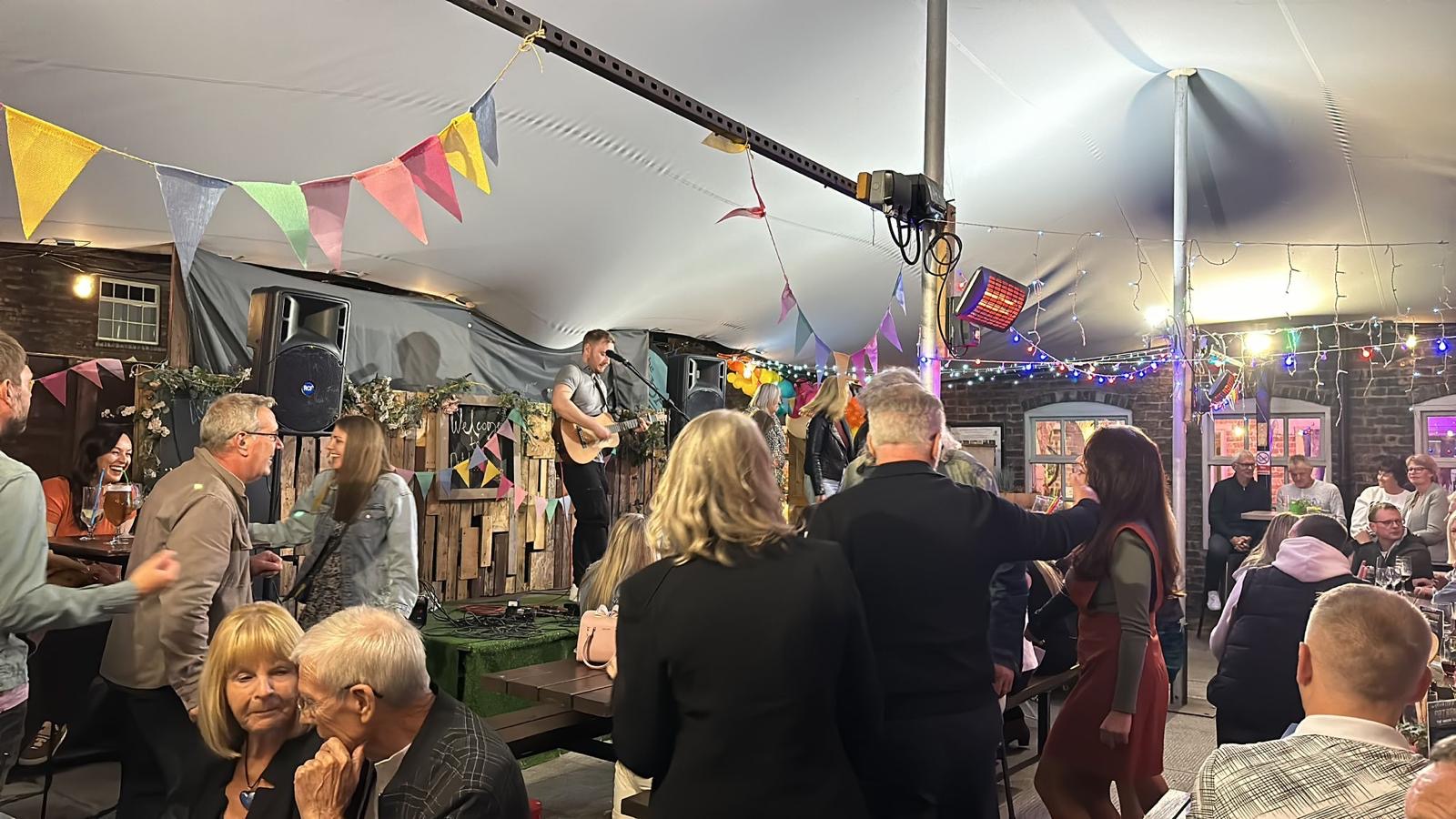 Guests watching Ben perform