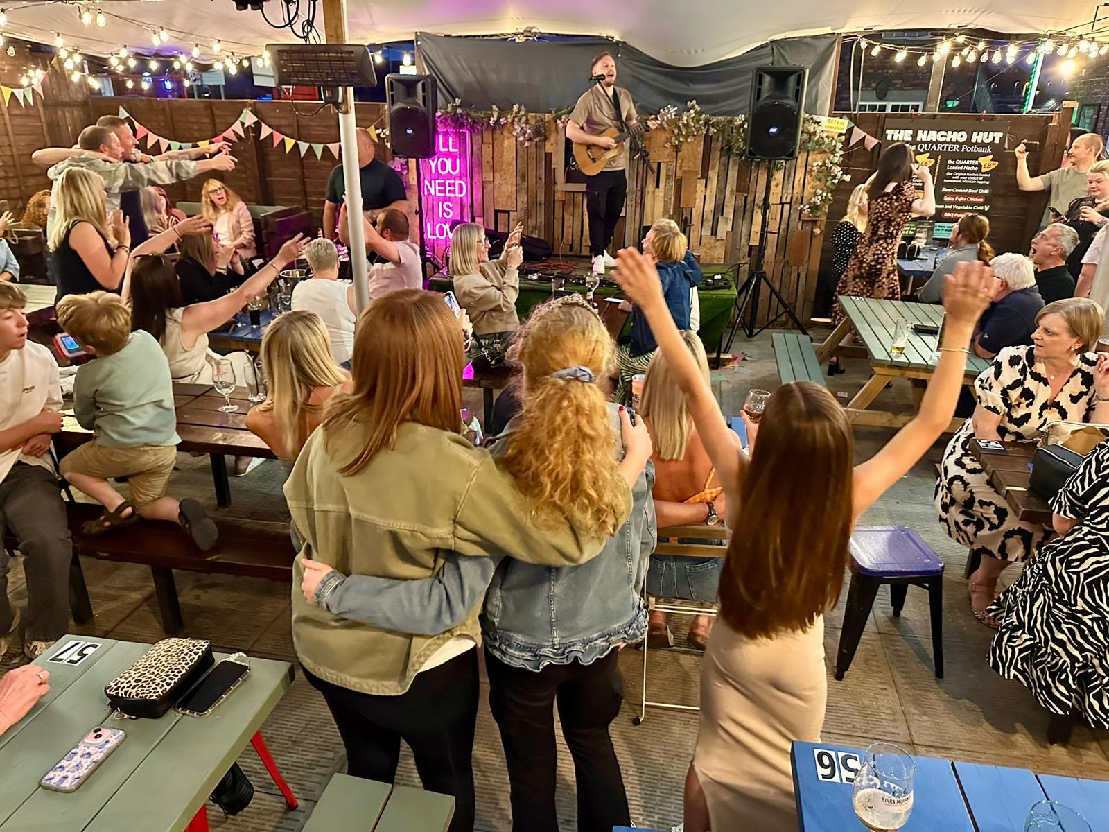 A lively crowd enjoying the performance
